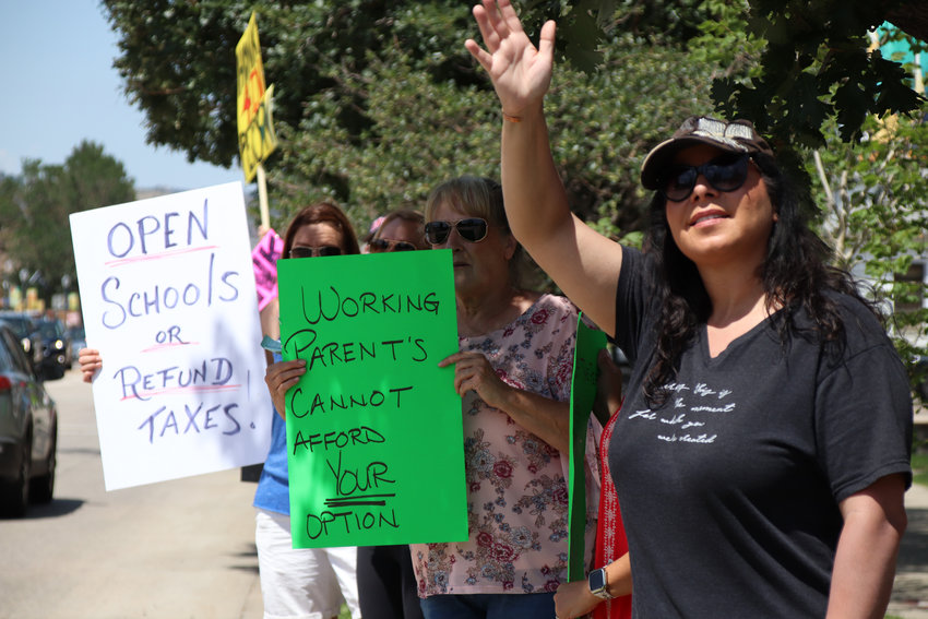 Among concerns expressed by protesters at a rally to reopen Douglas County schools on July 31 was childcare for families with working parents.